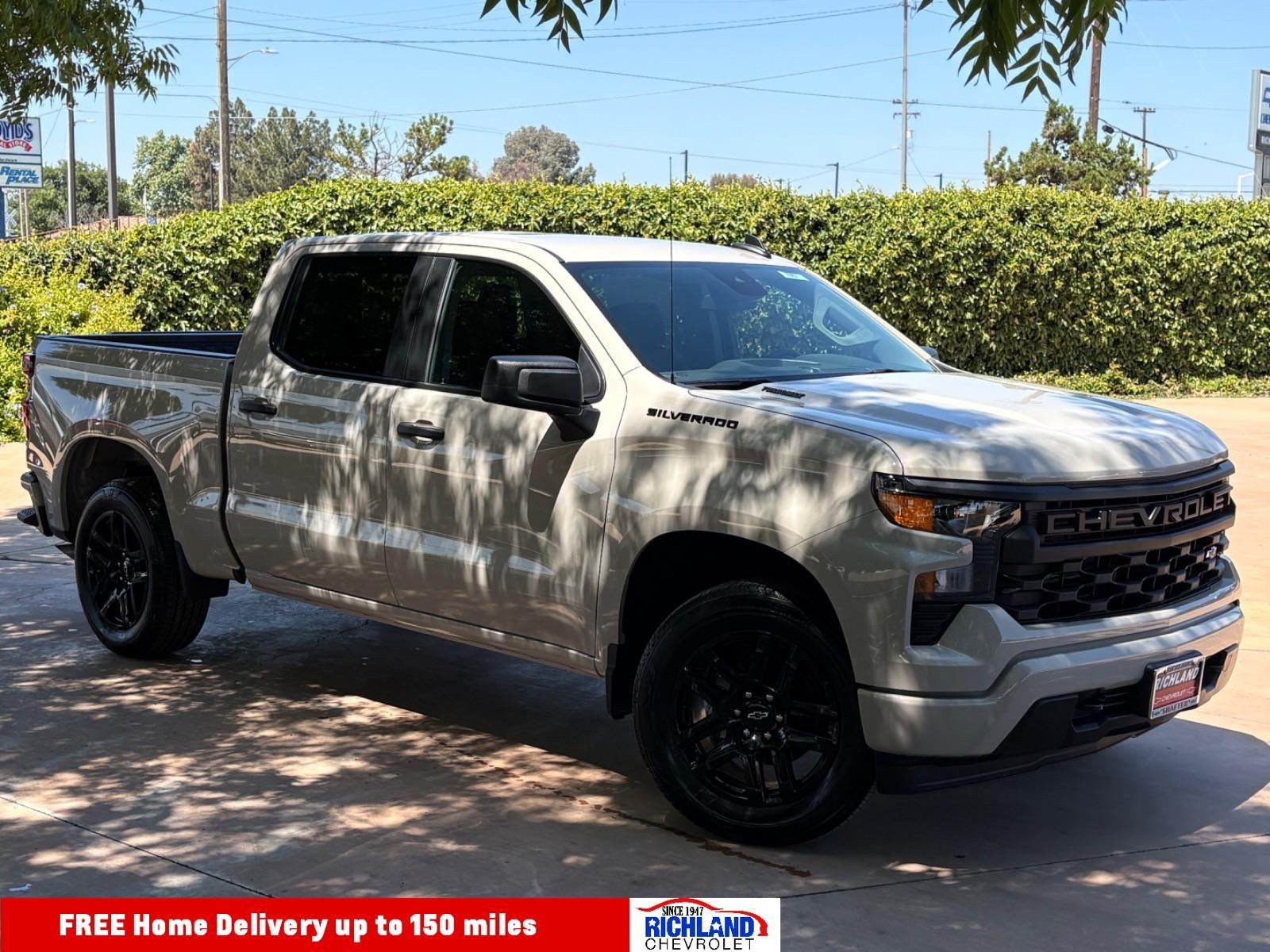 2026 Chevrolet Silverado 1500 Custom in White Sands — front three-quarter view
