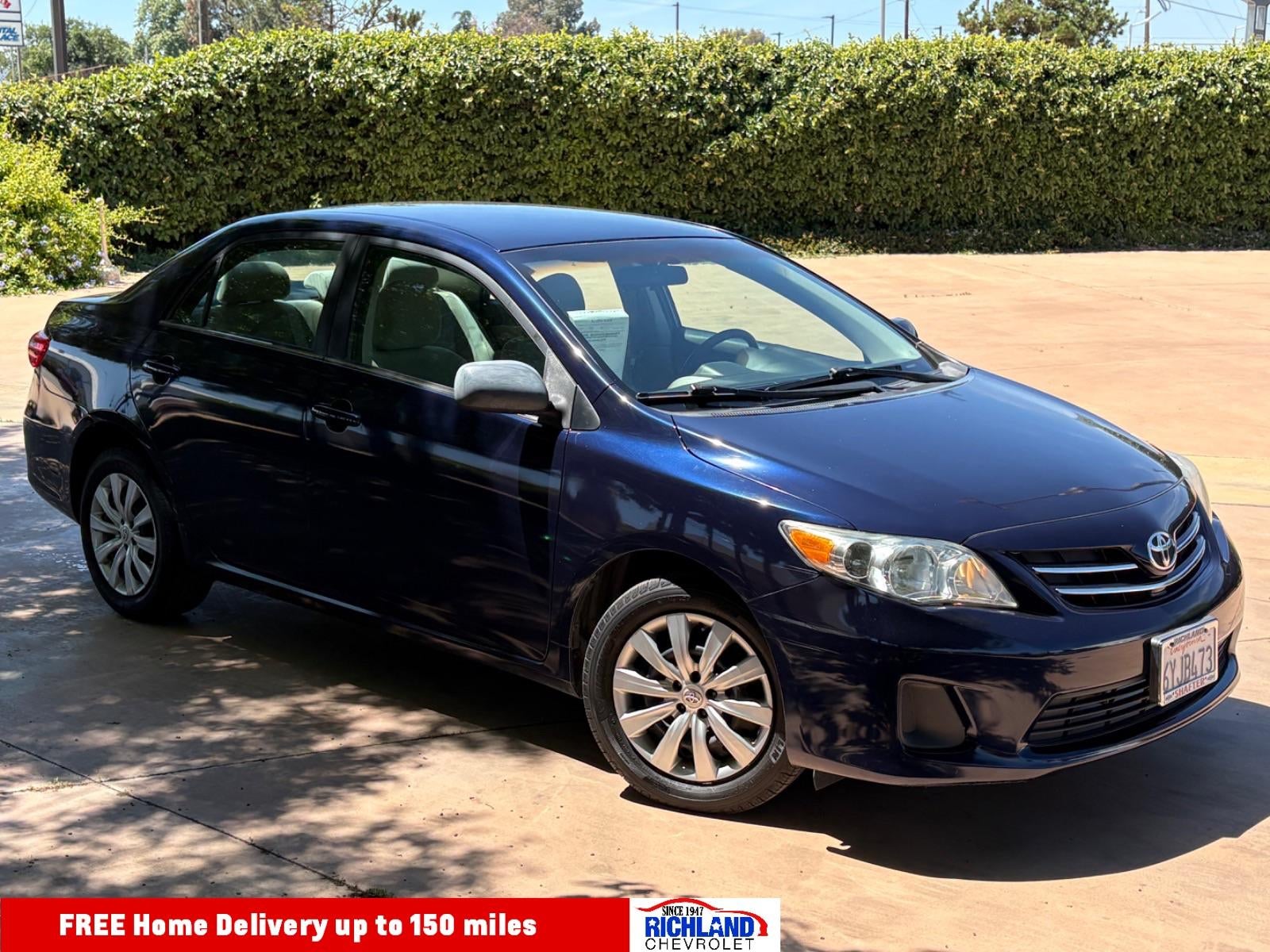 2013 Toyota Corolla L in Blue — front three-quarter view